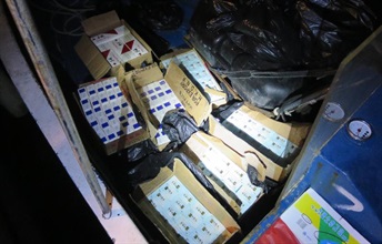 Suspected illicit cigarettes found on the motorised sampan.