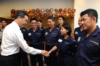 The Chief Executive, Mr C Y Leung, visited the Customs and Excise Department today (July 18). Photo shows Mr Leung chatting with Customs front-line officers to learn about the challenges they face in their work.