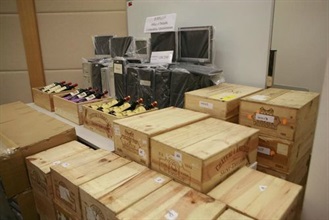The bottles of wine, the computers and the server seized by Hong Kong Customs.