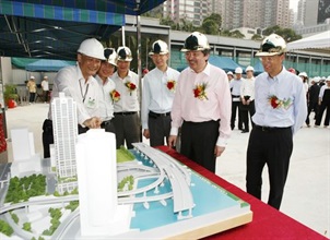 The Financial Secretary, Mr John C Tsang (second right); Commissioner of Customs and Excise, Mr Richard Yuen (first right); the Director of Architectural Services, Mr Yue Chi-hang (second left); Chairman of Shui On Group, Mr Vincent H S Lo (third left); and Deputy Commissioner of Customs and Excise, Mr Lawrence Wong (third right), today (October 8) view the model of the Customs Headquarters Building.<br />Briefing them is Senior Staff Officer of the Office of Project Planning and Development of Hong Kong Customs, Mr Ho Ka-ying (first left).