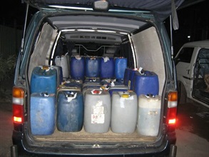 Customs Officers seized from a lorry departing from Kung Um Road 1,250 litres of illicit motor spirit and arrested a male driver.