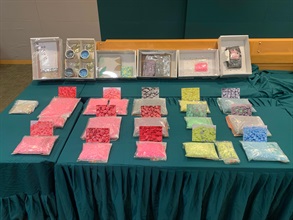 In the light of local demand for drugs during the long holidays, Hong Kong Customs mounted a special operation from November 1 to today (December 10) to combat party drug trafficking activities. Different kinds of party drugs with a total estimated value about $36 million were seized, including about 52 000 tablets of suspected ecstasy and about 153 kilograms of suspected cannabis buds. Photo shows some of the suspected ecstasy seized and the concealment methods.