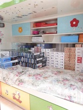 Illicit cigarettes stored in a residential unit.