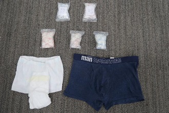 Hong Kong Customs yesterday (September 26) detected a trafficking in dangerous drugs case using underwear and a diaper and seized about 190 grams of different kinds of suspected dangerous drugs with an estimated market value of about $200,000 at the Hong Kong-Zhuhai-Macao Bridge Hong Kong Port. Photo shows the suspected dangerous drugs seized, with the underpants and the diaper.