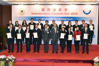 Mr Tsang (front row, fifth right) and Mr Cheung (front row, fifth left), pictured with officers of Hong Kong Customs and a representative of Hongkong Post who were awarded the World Customs Organization Certificate of Merit.