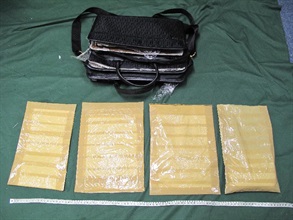 The suspected cocaine concealed inside the false compartment of the briefcase.