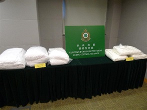 Some of the wool and silk quilts seized in the operation.