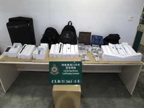 The seized smart watches and smartphones.