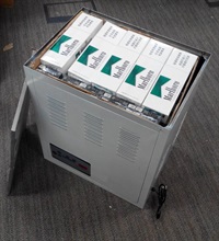 Picture shows illicit cigarettes concealed in a fake air dehumidifier.