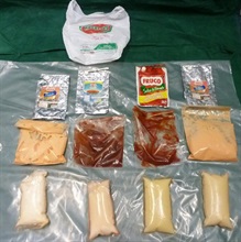 检获的可卡因毒品藏于四包沙律酱内。