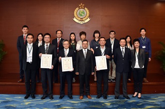 The Assistant Commissioner of Customs and Excise (Excise and Strategic Support), Mr David Fong (front row, centre), and representatives of the three Authorized Economic Operators at the presentation ceremony today (August 12).