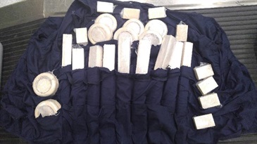 The tailor-made vest concealing the suspected worked ivory products.