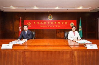 The Commissioner of Customs and Excise, Ms Louise Ho (right), and the Director General of the Guangdong Sub-Administration of the General Administration of Customs of the People's Republic of China, Mr Li Kuiwen (left), officiate at the 2023 Annual Review Meeting between Hong Kong and Guangdong Customs held in Hong Kong today (June 15).