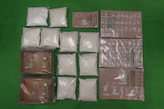 Hong Kong Customs conducted a series of anti-narcotics operations and detected four dangerous drug trafficking cases over the past two days (June 14 and 15). Suspected dangerous drugs worth about $6 million in total were seized at the Shenzhen Bay Control Point and in various districts across the territory. The seizures include about 10 kilograms of ketamine, about 1kg of crack cocaine, a small quantity of cocaine and methamphetamine as well as a batch of suspected drug manufacturing paraphernalia and drug-inhaling apparatus. Photo shows the suspected dangerous drugs and suspected drug-inhaling apparatus seized by Customs officers in the first three cases.