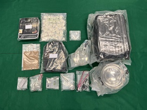 Hong Kong Customs conducted a series of anti-narcotics operations and detected four dangerous drug trafficking cases over the past two days (June 14 and 15). Suspected dangerous drugs worth about $6 million in total were seized at the Shenzhen Bay Control Point and in various districts across the territory. The seizures include about 10 kilograms of ketamine, about 1kg of crack cocaine, a small quantity of cocaine and methamphetamine as well as a batch of suspected drug manufacturing paraphernalia and drug-inhaling apparatus. Photo shows the suspected dangerous drugs and suspected drug manufacturing paraphernalia seized by Customs officers in the fourth case.