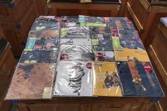 Hong Kong Customs on June 13 detected a suspected case of an ocean-going vessel being used to smuggle goods to the Mainland via Singapore at the Kwai Tsing Container Terminals. A large batch of suspected smuggled goods, including electronic goods, expensive food ingredients, table wines, music records and scheduled endangered species, with a total estimated market value of about $1.5 billion was seized. This is the largest smuggling case detected by Customs on record in terms of the seizure value. Photo shows some of the suspected smuggled vinyl records seized.