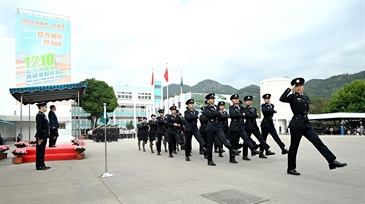 Hong Kong Customs Passing-out Parade was held today (December 8). Photo shows passing-out officers adopting the Chinese-style foot drill to perform the parade.