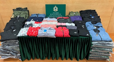 Hong Kong Customs yesterday (January 15) conducted a special operation in Tin Shui Wai and Kwai Chung, and cracked down on one mobile hawker stall and its storage place successfully. A total of about 1,900 items of suspected counterfeit apparel with an estimated market value of about $480,000 were seized. Photo shows some of the suspected counterfeit apparel seized.