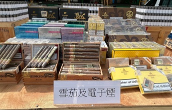 Hong Kong Customs on February 29 and March 2 detected two suspected smuggling cases involving river trade vessels. A large batch of suspected smuggled goods with a total estimated market value of about $211 million was seized. Photo shows some of the suspected smuggled cigars and electronic cigarettes seized.