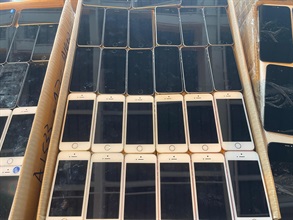 Hong Kong Customs on March 7 detected a suspected smuggling case involving a river trade vessel. A large batch of suspected smuggled goods with a total estimated market value of about $24 million was seized. Photo shows some of the suspected smuggled mobile phones seized.