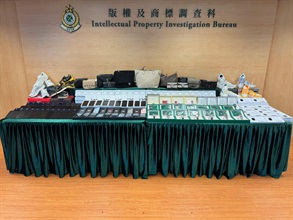 Hong Kong Customs conducted a three-week joint enforcement operation with the Mainland and Macao Customs from April 9 to 30, during which inspection of goods across the three places and destined for North America, Europe and Asia as well as other countries and regions was stepped up, with a view to combating cross-boundary counterfeiting activities among the three places with goods destined for overseas countries. During the operation, Hong Kong Customs detected 19 cases and seized about 56 000 items of suspected counterfeit goods, including handbags, mobile phones and accessories, watches and footwear, with a total estimated market value of about $16.9 million. Photo shows some of suspected counterfeit goods seized.