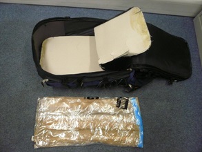 Hong Kong Customs seized about three kilogrammes of methamphetamine ("Ice") from the concealed compartment of a luggage belonged to a woman from Johannesburg of South Africa at Hong Kong International Airport today (October 17) .