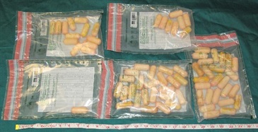 Pellets of cocaine seized.