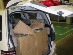 Suspected illicit cigarettes were seized by Customs from a seven-seater private car.