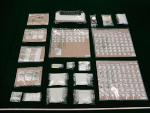 Hong Kong Customs yesterday (July 15) seized about 1.6 kilograms of suspected ketamine, about 32 grams of suspected methamphetamine and a small quantity of suspected herbal cannabis with an estimated market value of about $830,000 in Tsuen Wan. Photo shows the suspected dangerous drugs and drug packaging paraphernalia seized.