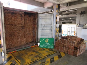 Hong Kong Customs detected three smuggling cases involving scheduled wood logs at the Kwai Chung Customhouse Cargo Examination Compound between June 30 and July 16. A total of about 142 tonnes of suspected scheduled wood logs of endangered species, with an estimated market value of about $1.2 million in total, were seized. Photo shows some of the suspected scheduled wood logs of endangered species seized.