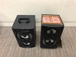 Hong Kong Customs yesterday (August 4) seized about 620 000 suspected illicit cigarettes with an estimated market value of about $1.7 million and a duty potential of about $1.2 million at Shenzhen Bay Control Point. Photo shows some of the seized suspected illicit cigarettes concealed inside a speaker.