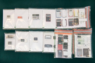 Hong Kong Customs mounted an operation codenamed "Shadow Hunter" in September and successfully smashed a large-scale money laundering syndicate involving a family of five and a local money changer. The amount involved in the case was over $3 billion, which is the largest ever among similar cases handled by Customs. Photo shows some of the banking security authentication tokens involved in the case.