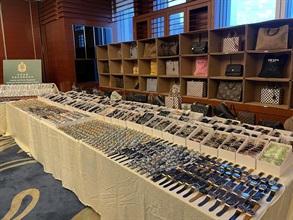 Hong Kong Customs conducted an operation codenamed "Tracer II" over the past two weeks to combat cross-boundary transhipment and local sale of counterfeit goods and seized about 80 000 items of suspected counterfeit goods, including watches, mobile phone accessories, sunglasses and fashion accessories, with an estimated market value of over $22 million. Photo shows some of the suspected counterfeit goods seized.