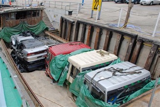 Photo shows the smuggled dismantled vehicles seized.