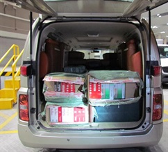 The suspected illicit cigarettes found in a cross-boundary private car by Customs.