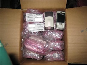 Hong Kong Customs investigators raided a storage centre in Fanling, seizing a large batch of smuggled mobile phones.
