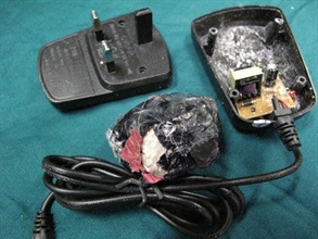 Close-up of a charger being disassembled.