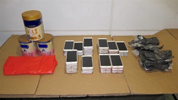 Smartphones and powdered formula seized from an outgoing lorry by Customs.