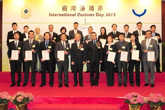 Mr Lam (front row, fifth left) and Mr Cheung (front row, fifth right) with Hong Kong Customs officers who were awarded the World Customs Organization Certificate of Merit.
