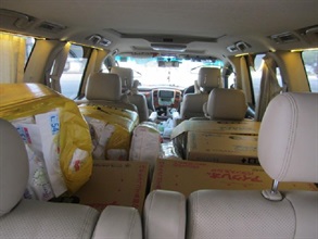 Unmanifested milk powder and diapers were found on the rear passenger seats of the outgoing private car.