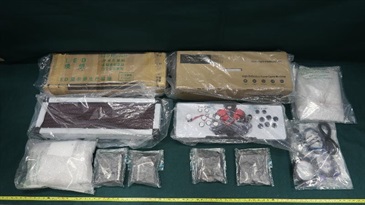 Hong Kong Customs yesterday (October 29) and today (October 30) seized about 5.6 kilograms of suspected methamphetamine with an estimated market value of about $3.4 million in Tsing Yi. Photo shows some of the suspected methamphetamine seized and the light box and game console used to conceal the dangerous drugs.