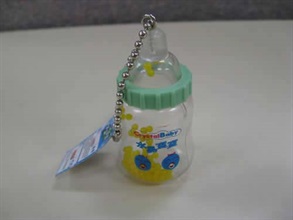 Photo shows an unsafe toy with expandable plastic beads.<br />Beads, each measuring about 2mm in diameter, were placed in a plastic container in the shape of a tiny baby milk bottle marked with wordings "Crystal Baby" and put on sale in vending machines.
