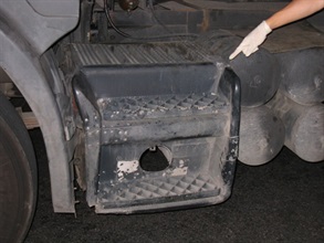 In a vehicle search, Customs officers found seven silver slabs and 1,752 pieces of RAMs concealed inside a hollow space after removing a two-tier staircase affixed behind the mudguard of the left front wheel.