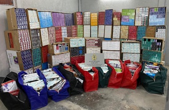 Hong Kong Customs yesterday (December 9) seized about 1 million suspected illicit cigarettes and 24 000 suspected illicit heat-not-burn (HNB) products with an estimated market value of about $2.9 million and a duty potential of about $2 million in Yuen Long. Photo shows the suspected illicit cigarettes and illicit HNB products seized.