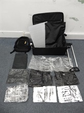 Hong Kong Customs seized about 2.1 kilograms of suspected cocaine, with a market value of about $2.2 million, at Hong Kong International Airport yesterday (July 14). The suspected cocaine was found concealed inside the false compartments of a suitcase and a backpack placed inside the suitcase.