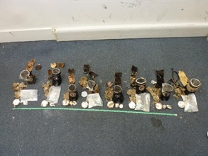 Hong Kong Customs seized a total of about 1 600 grams of suspected cocaine at the Air Mail Centre, Hong Kong International Airport, on July 17, 22 and 23. Photo shows suspected cocaine found concealed in eight pieces of handicraft products.