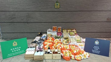 Hong Kong Customs and the Marine Police today (March 4) conducted an anti-smuggling joint-operation and detected two suspected smuggling cases using fishing vessels in the waters of Lau Fau Shan. A large batch of suspected smuggled goods including vehicle parts, cosmetics, wines and fruits with an estimated market value of about $550,000 were seized.