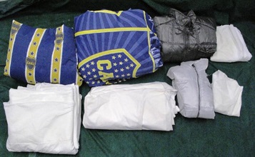 Two jackets and two quilts with cocaine found in the checked suitcase.