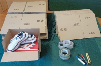 Hong Kong Customs seized about 1 100 items of suspected counterfeit sports footwear and children's clothing with an estimated market value of about $800,000 at Shenzhen Bay Control Point, in Tsuen Wan and in Tsing Yi from October 28 to November 1. Photo shows some of the tools used to pack the suspected counterfeit sports footwear.