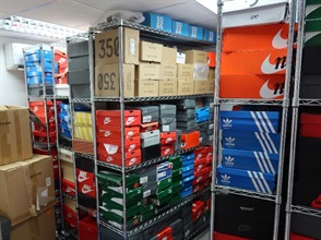Hong Kong Customs seized about 1 100 items of suspected counterfeit sports footwear and children's clothing with an estimated market value of about $800,000 at Shenzhen Bay Control Point, in Tsuen Wan and in Tsing Yi from October 28 to November 1. Photo shows a storehouse of suspected counterfeit sports footwear raided by Customs officers.